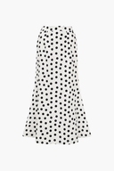 Elegante traje de baño de lunares y pareo